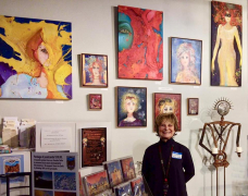 <p>An enthusiastic Judy Bruce in front of her mixed media expressive work!</p>