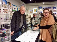 <p>John with our jeweler and dear friend, Lesley McKeown hamming it up looking at her extraordinary work.</p>