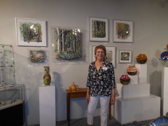 <h5>Bonny Stauffer</h5><p>Bonny Stauffer in front of her amazing 3-D pieces.
</p>