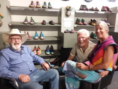 <p>Otto (center) surrounded by friends in our shoe department.</p>