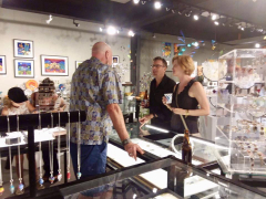 <p>Our John showing Chris Marchetti and friend, Lesley McKeown’s jewelry.</p>
