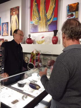 <p>Our jeweler, the famous Kit Carson, showing his work to guests.
</p>