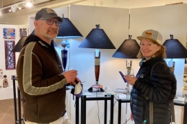 <p>Nice couple admiring Frank Luetke’s contemporary lamps.</p>