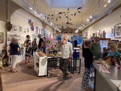 <p>A good crowd enjoying the music, wine and of course…ART!</p>
