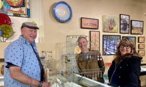 <p>Our Johnny showing jewelry to happy customers!</p>