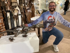 <p>We had to take a photo of this gentleman’s shirt next to our own T-Rex by Adam Homan!</p>
