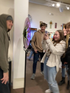 <p>This group having fun taking photos through glass rondel by Nate Macomber!</p>